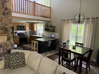 Nestled in the heart of Lakewood, this beautifully updated home on McCauslin Brook Golf and Country Club in Wisconsin - for sale on GolfHomes.com, golf home, golf lot