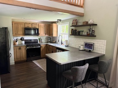 Nestled in the heart of Lakewood, this beautifully updated home on McCauslin Brook Golf and Country Club in Wisconsin - for sale on GolfHomes.com, golf home, golf lot