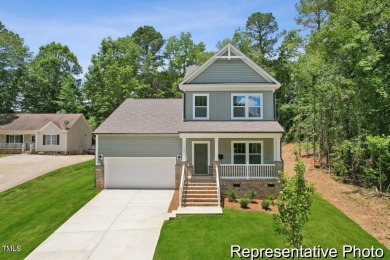 This semi-custom home in Lake Royale offers 3BR/2.5BA and 2,098 on River Golf and County Club at Lake Royale in North Carolina - for sale on GolfHomes.com, golf home, golf lot