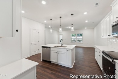 This semi-custom home in Lake Royale offers 3BR/2.5BA and 2,098 on River Golf and County Club at Lake Royale in North Carolina - for sale on GolfHomes.com, golf home, golf lot