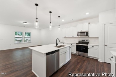 This semi-custom home in Lake Royale offers 3BR/2.5BA and 2,098 on River Golf and County Club at Lake Royale in North Carolina - for sale on GolfHomes.com, golf home, golf lot