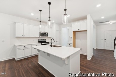 This semi-custom home in Lake Royale offers 3BR/2.5BA and 2,098 on River Golf and County Club at Lake Royale in North Carolina - for sale on GolfHomes.com, golf home, golf lot