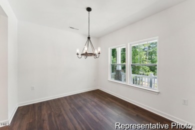 This semi-custom home in Lake Royale offers 3BR/2.5BA and 2,098 on River Golf and County Club at Lake Royale in North Carolina - for sale on GolfHomes.com, golf home, golf lot