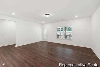 This semi-custom home in Lake Royale offers 3BR/2.5BA and 2,098 on River Golf and County Club at Lake Royale in North Carolina - for sale on GolfHomes.com, golf home, golf lot