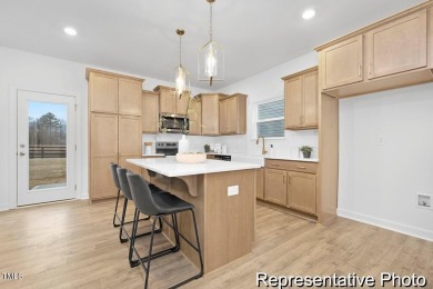 This semi-custom home in Lake Royale offers 3BR/2.5BA and over 2 on River Golf and County Club at Lake Royale in North Carolina - for sale on GolfHomes.com, golf home, golf lot