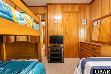 Exceptional contemporary beach home minutes from direct beach on The Currituck Golf Club in North Carolina - for sale on GolfHomes.com, golf home, golf lot