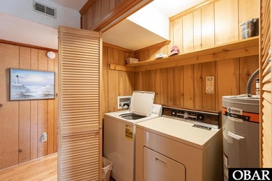 Exceptional contemporary beach home minutes from direct beach on The Currituck Golf Club in North Carolina - for sale on GolfHomes.com, golf home, golf lot