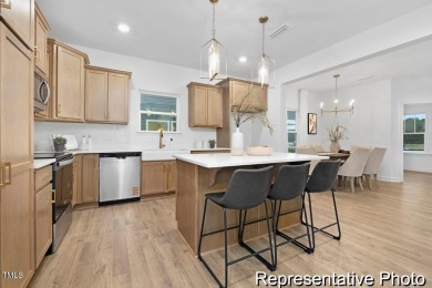 This semi-custom home in Lake Royale offers 3BR/2.5BA and over 2 on River Golf and County Club at Lake Royale in North Carolina - for sale on GolfHomes.com, golf home, golf lot