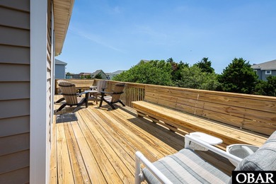 Exceptional contemporary beach home minutes from direct beach on The Currituck Golf Club in North Carolina - for sale on GolfHomes.com, golf home, golf lot