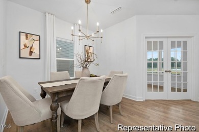 This semi-custom home in Lake Royale offers 3BR/2.5BA and over 2 on River Golf and County Club at Lake Royale in North Carolina - for sale on GolfHomes.com, golf home, golf lot
