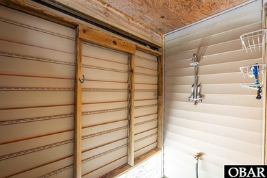 Exceptional contemporary beach home minutes from direct beach on The Currituck Golf Club in North Carolina - for sale on GolfHomes.com, golf home, golf lot