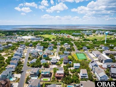 Exceptional contemporary beach home minutes from direct beach on The Currituck Golf Club in North Carolina - for sale on GolfHomes.com, golf home, golf lot