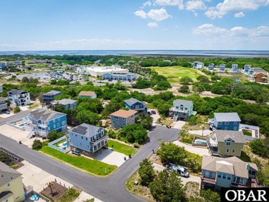 Exceptional contemporary beach home minutes from direct beach on The Currituck Golf Club in North Carolina - for sale on GolfHomes.com, golf home, golf lot