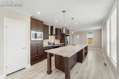 Experience modern country living with breathtaking mountain on Hollydot Golf Course in Colorado - for sale on GolfHomes.com, golf home, golf lot