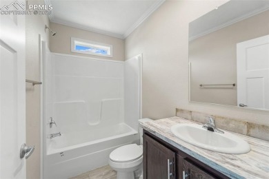 Experience modern country living with breathtaking mountain on Hollydot Golf Course in Colorado - for sale on GolfHomes.com, golf home, golf lot