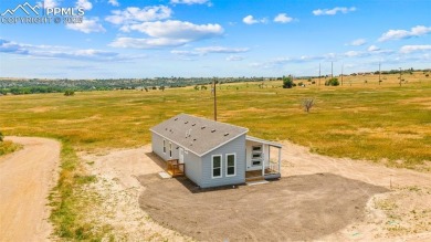 Experience modern country living with breathtaking mountain on Hollydot Golf Course in Colorado - for sale on GolfHomes.com, golf home, golf lot