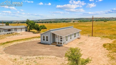 Experience modern country living with breathtaking mountain on Hollydot Golf Course in Colorado - for sale on GolfHomes.com, golf home, golf lot
