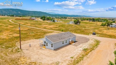 Experience modern country living with breathtaking mountain on Hollydot Golf Course in Colorado - for sale on GolfHomes.com, golf home, golf lot