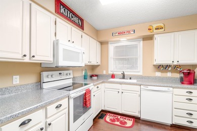 Enjoy beautiful Lake DeSoto views from the spacious deck of this on DeSoto Golf Course in Arkansas - for sale on GolfHomes.com, golf home, golf lot