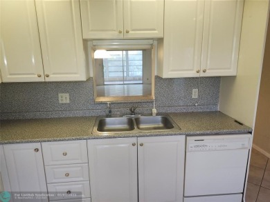 WYNMOOR--HOPA---MUST BE 55+ TO LIVE HERE-- LOCATED IN  A 24 HOUR on Wynmoor Golf Course in Florida - for sale on GolfHomes.com, golf home, golf lot