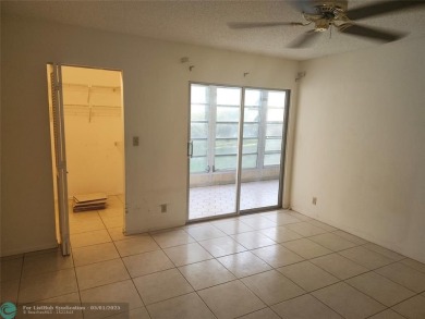 WYNMOOR--HOPA---MUST BE 55+ TO LIVE HERE-- LOCATED IN  A 24 HOUR on Wynmoor Golf Course in Florida - for sale on GolfHomes.com, golf home, golf lot