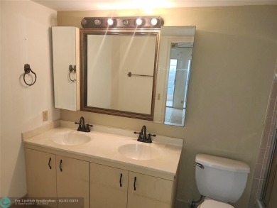 WYNMOOR--HOPA---MUST BE 55+ TO LIVE HERE-- LOCATED IN  A 24 HOUR on Wynmoor Golf Course in Florida - for sale on GolfHomes.com, golf home, golf lot