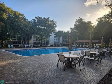 WYNMOOR--HOPA---MUST BE 55+ TO LIVE HERE-- LOCATED IN  A 24 HOUR on Wynmoor Golf Course in Florida - for sale on GolfHomes.com, golf home, golf lot