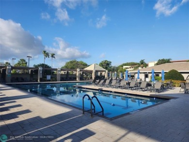 WYNMOOR--HOPA---MUST BE 55+ TO LIVE HERE-- LOCATED IN  A 24 HOUR on Wynmoor Golf Course in Florida - for sale on GolfHomes.com, golf home, golf lot