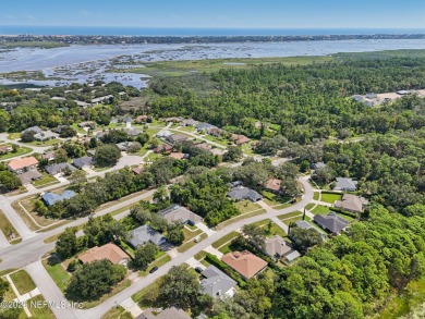 This vacant lot (10,018 sq. ft.) offers the chance to design and on St. Augustine Shores Golf Club in Florida - for sale on GolfHomes.com, golf home, golf lot