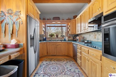 This is a custom Lindal Cedar Home that is designed to blend on Doe Valley Country Club in Kentucky - for sale on GolfHomes.com, golf home, golf lot