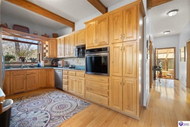 This is a custom Lindal Cedar Home that is designed to blend on Doe Valley Country Club in Kentucky - for sale on GolfHomes.com, golf home, golf lot
