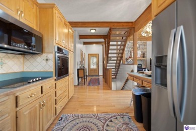 This is a custom Lindal Cedar Home that is designed to blend on Doe Valley Country Club in Kentucky - for sale on GolfHomes.com, golf home, golf lot
