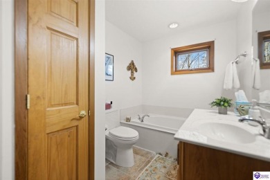 This is a custom Lindal Cedar Home that is designed to blend on Doe Valley Country Club in Kentucky - for sale on GolfHomes.com, golf home, golf lot