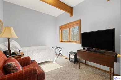 This is a custom Lindal Cedar Home that is designed to blend on Doe Valley Country Club in Kentucky - for sale on GolfHomes.com, golf home, golf lot