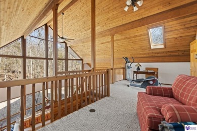 This is a custom Lindal Cedar Home that is designed to blend on Doe Valley Country Club in Kentucky - for sale on GolfHomes.com, golf home, golf lot