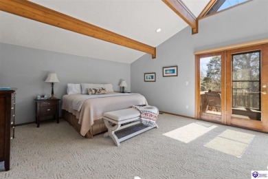 This is a custom Lindal Cedar Home that is designed to blend on Doe Valley Country Club in Kentucky - for sale on GolfHomes.com, golf home, golf lot