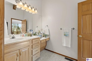 This is a custom Lindal Cedar Home that is designed to blend on Doe Valley Country Club in Kentucky - for sale on GolfHomes.com, golf home, golf lot
