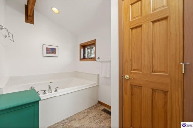 This is a custom Lindal Cedar Home that is designed to blend on Doe Valley Country Club in Kentucky - for sale on GolfHomes.com, golf home, golf lot