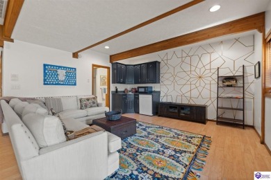This is a custom Lindal Cedar Home that is designed to blend on Doe Valley Country Club in Kentucky - for sale on GolfHomes.com, golf home, golf lot
