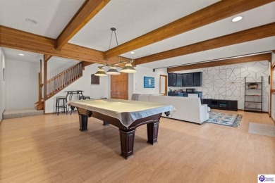 This is a custom Lindal Cedar Home that is designed to blend on Doe Valley Country Club in Kentucky - for sale on GolfHomes.com, golf home, golf lot