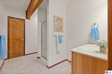 This is a custom Lindal Cedar Home that is designed to blend on Doe Valley Country Club in Kentucky - for sale on GolfHomes.com, golf home, golf lot