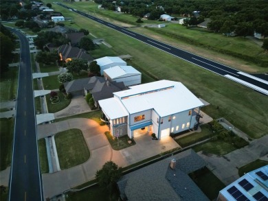 Don't miss your rare opportunity to live with your airplanes on Pecan Plantation Country Club in Texas - for sale on GolfHomes.com, golf home, golf lot
