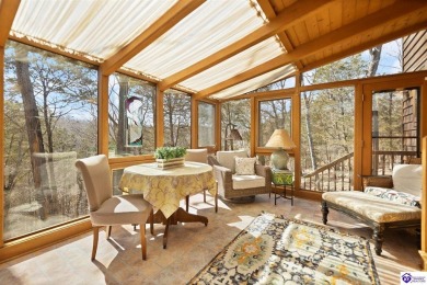 This is a custom Lindal Cedar Home that is designed to blend on Doe Valley Country Club in Kentucky - for sale on GolfHomes.com, golf home, golf lot