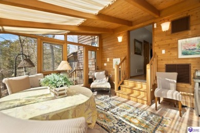 This is a custom Lindal Cedar Home that is designed to blend on Doe Valley Country Club in Kentucky - for sale on GolfHomes.com, golf home, golf lot