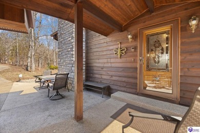This is a custom Lindal Cedar Home that is designed to blend on Doe Valley Country Club in Kentucky - for sale on GolfHomes.com, golf home, golf lot