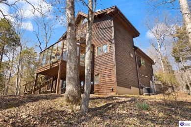 This is a custom Lindal Cedar Home that is designed to blend on Doe Valley Country Club in Kentucky - for sale on GolfHomes.com, golf home, golf lot