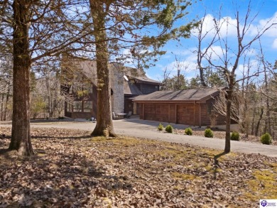 This is a custom Lindal Cedar Home that is designed to blend on Doe Valley Country Club in Kentucky - for sale on GolfHomes.com, golf home, golf lot