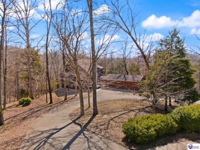 This is a custom Lindal Cedar Home that is designed to blend on Doe Valley Country Club in Kentucky - for sale on GolfHomes.com, golf home, golf lot