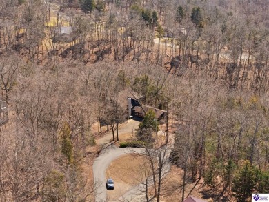 This is a custom Lindal Cedar Home that is designed to blend on Doe Valley Country Club in Kentucky - for sale on GolfHomes.com, golf home, golf lot