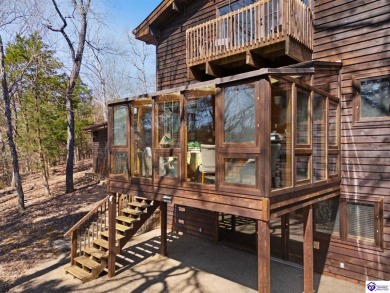 This is a custom Lindal Cedar Home that is designed to blend on Doe Valley Country Club in Kentucky - for sale on GolfHomes.com, golf home, golf lot